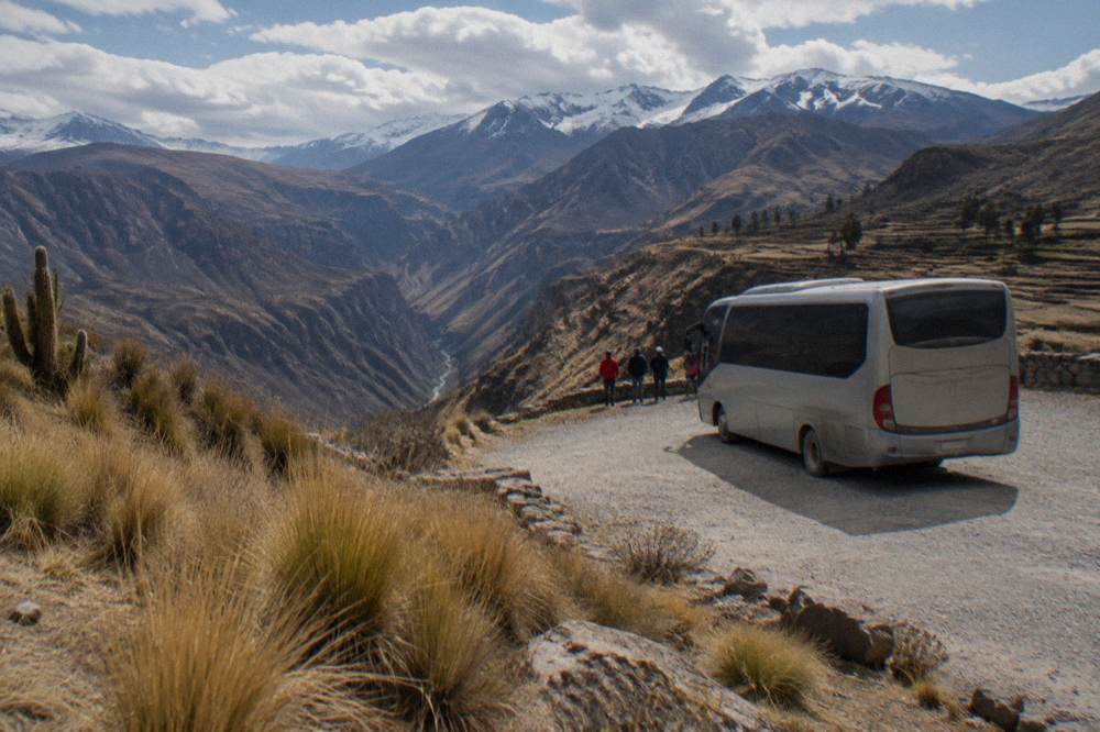 Tourist bus parked at a high mountain viewpoint on the altiplano