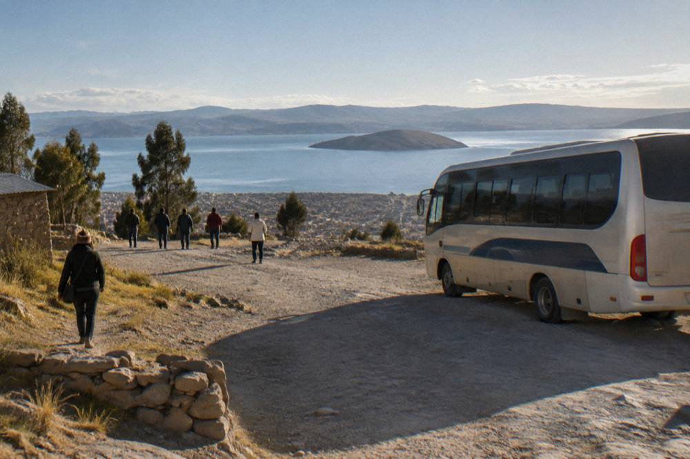 Tourist coach parked at a viewpoint above the altiplano with a wide lake horizon beyond