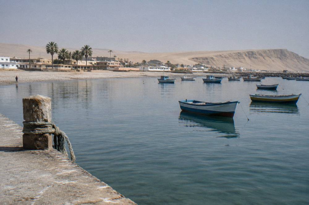 Small boats moored on a sheltered bay at Paracas
